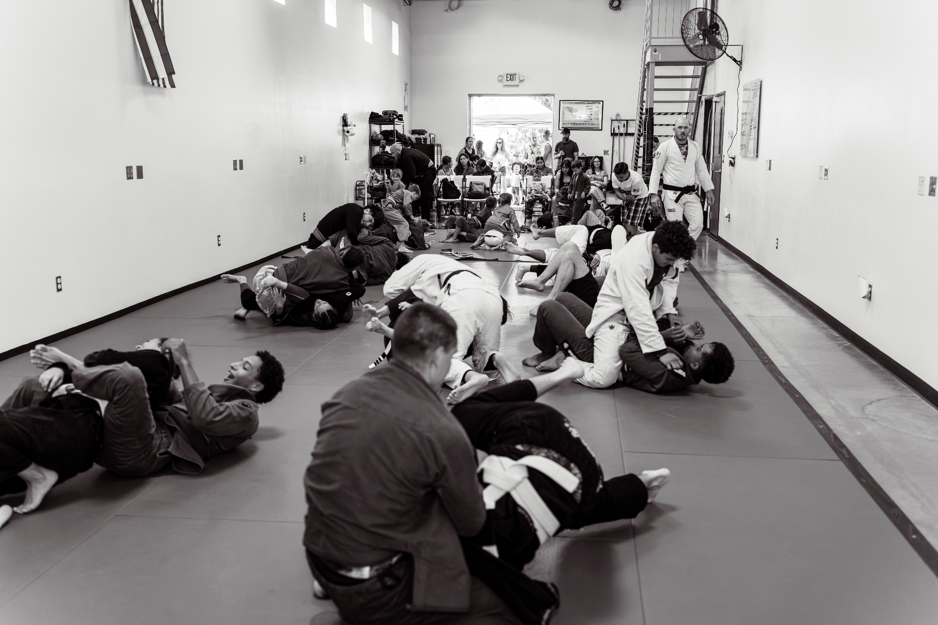 Students training together during a Brazilian Jiu-Jitsu class at Grounded Strength Academy